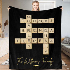 Black crossword letter tiles blanket featuring interlocking wooden alphabet tiles and golden accents.