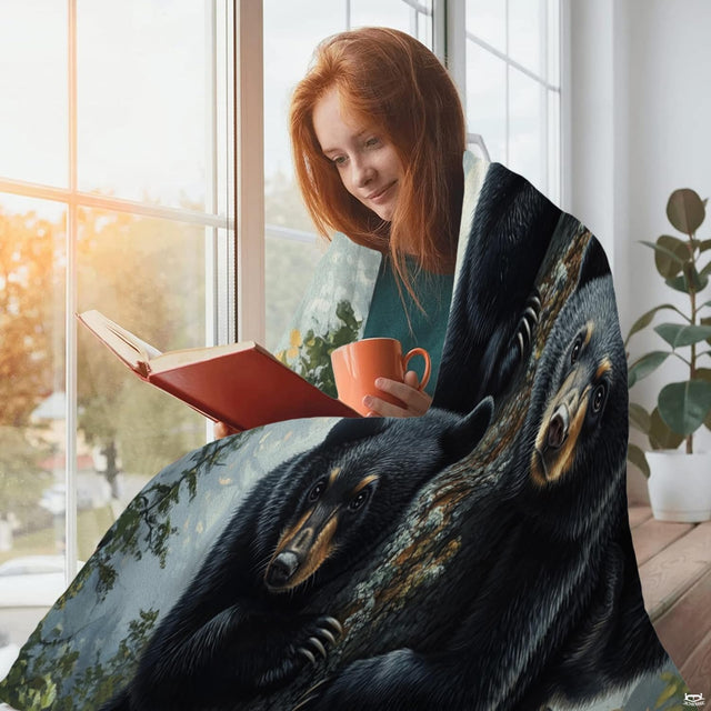 Playful bear cubs throw blanket draped across living room couch