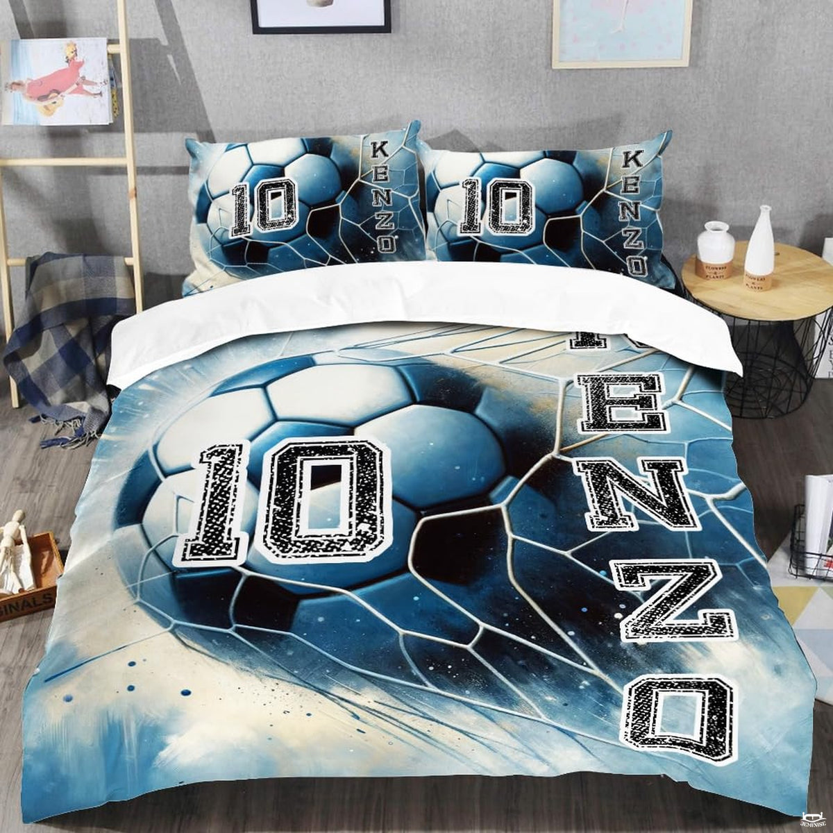 Close-up view of soccer bedding detailing the central soccer ball graphic and steel blue accents