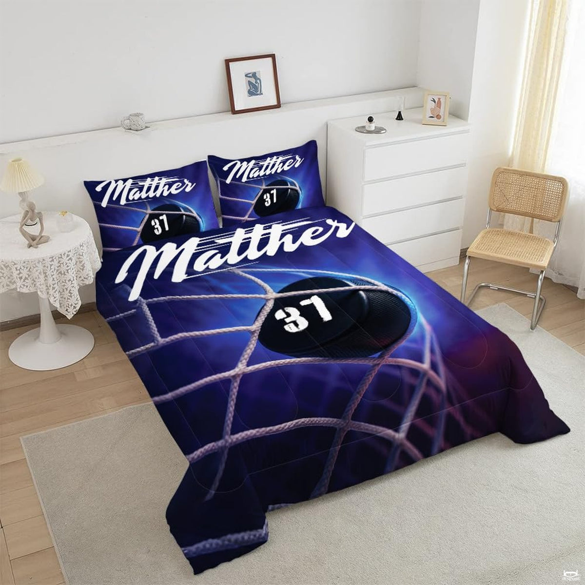 Close-up perspective of hockey bedding highlighting goalie silhouette, ice spray effects, and equipment graphics