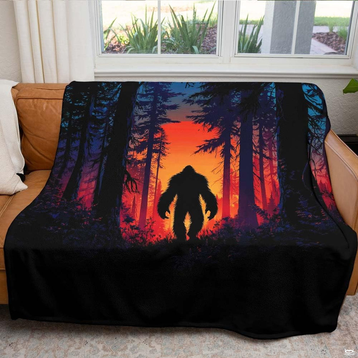 Sunset Bigfoot throw blanket view 5 highlighting fiery amber sunset and pine timber silhouettes