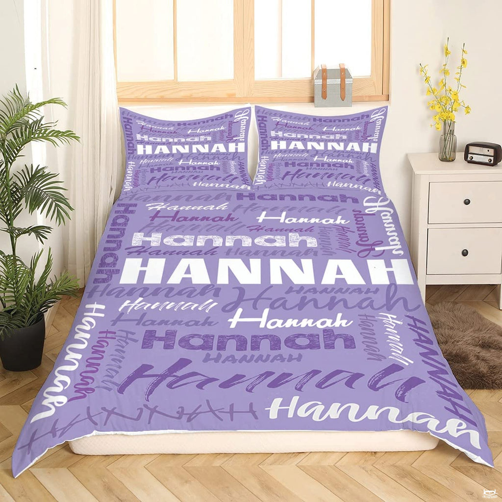 Lilac and violet word art bedding display complemented by contemporary bedroom furnishings.
