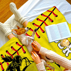 Close-up view of bursting ball and shattered fissure illustration on sports throw blanket.
