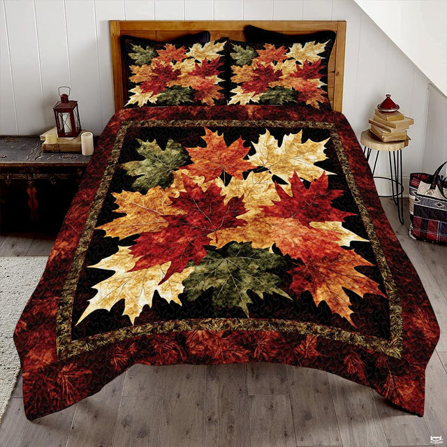 Autumn maple leaves bedding featuring layered crimson, amber, and sage foliage framed by a rustic border