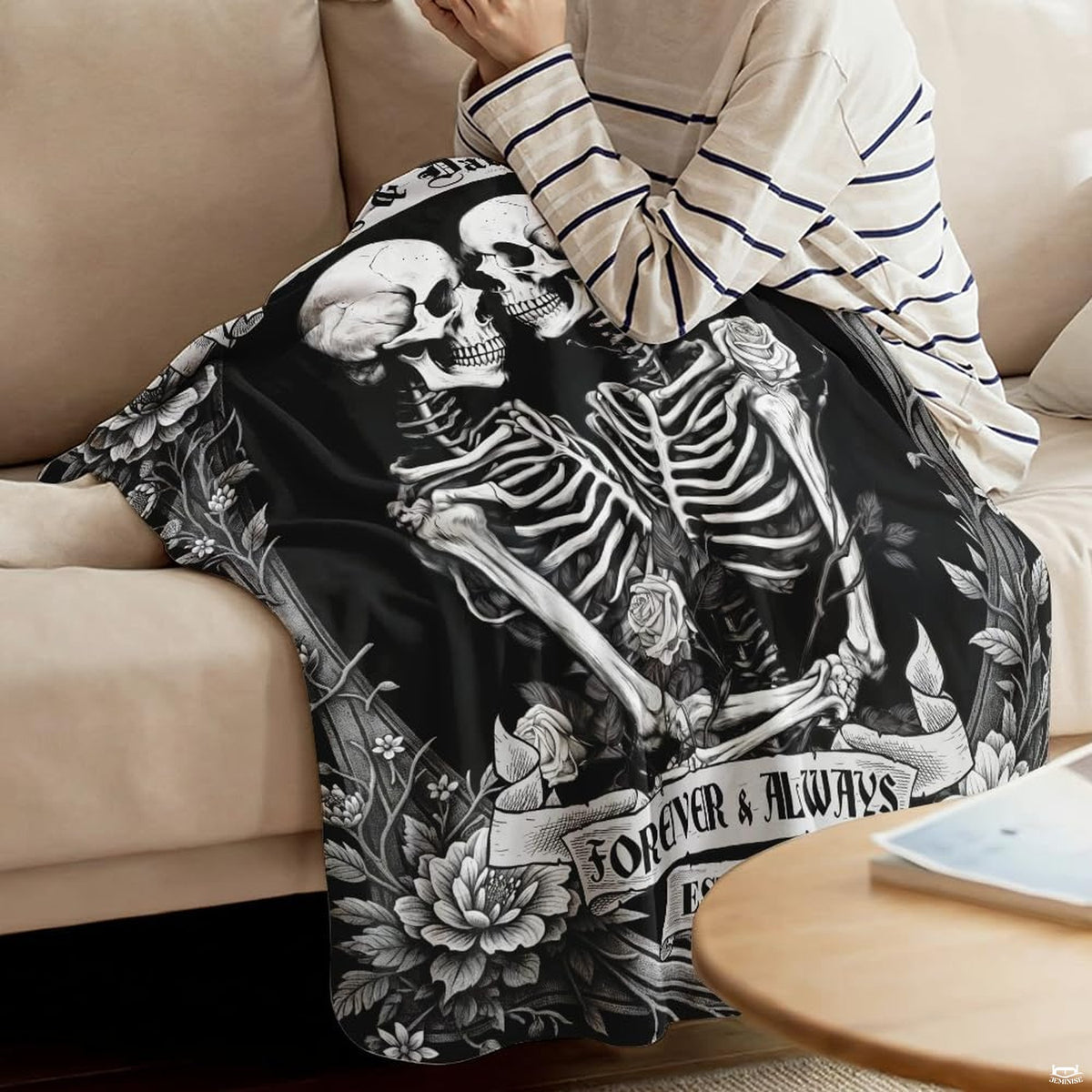 Alternative bedroom decor display featuring black and white skeleton artwork on bedding.