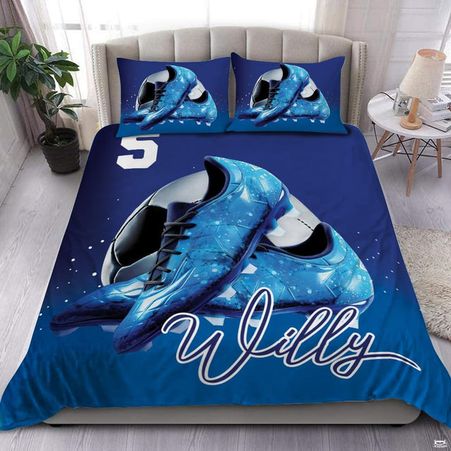 Blue soccer cleats sports bedding featuring athletic soccer footwear and a soccer ball graphic on a bed