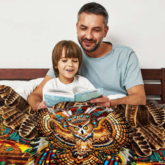Detailed tribal owl artwork with outstretched wings on an Indian bedding set.