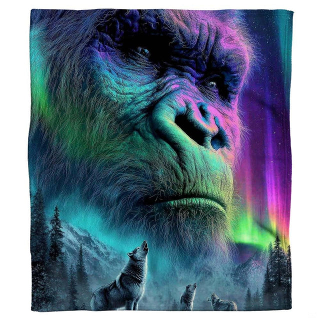 Sasquatch aurora throw blanket view 2 highlighting guardian face artwork, howling wolf silhouettes, and alpine pines