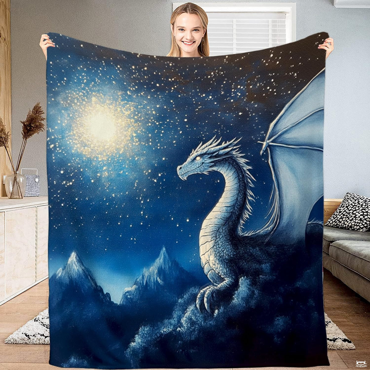 Majestic ice dragon atop snowy mountain peaks under a celestial night sky with glowing golden starburst.