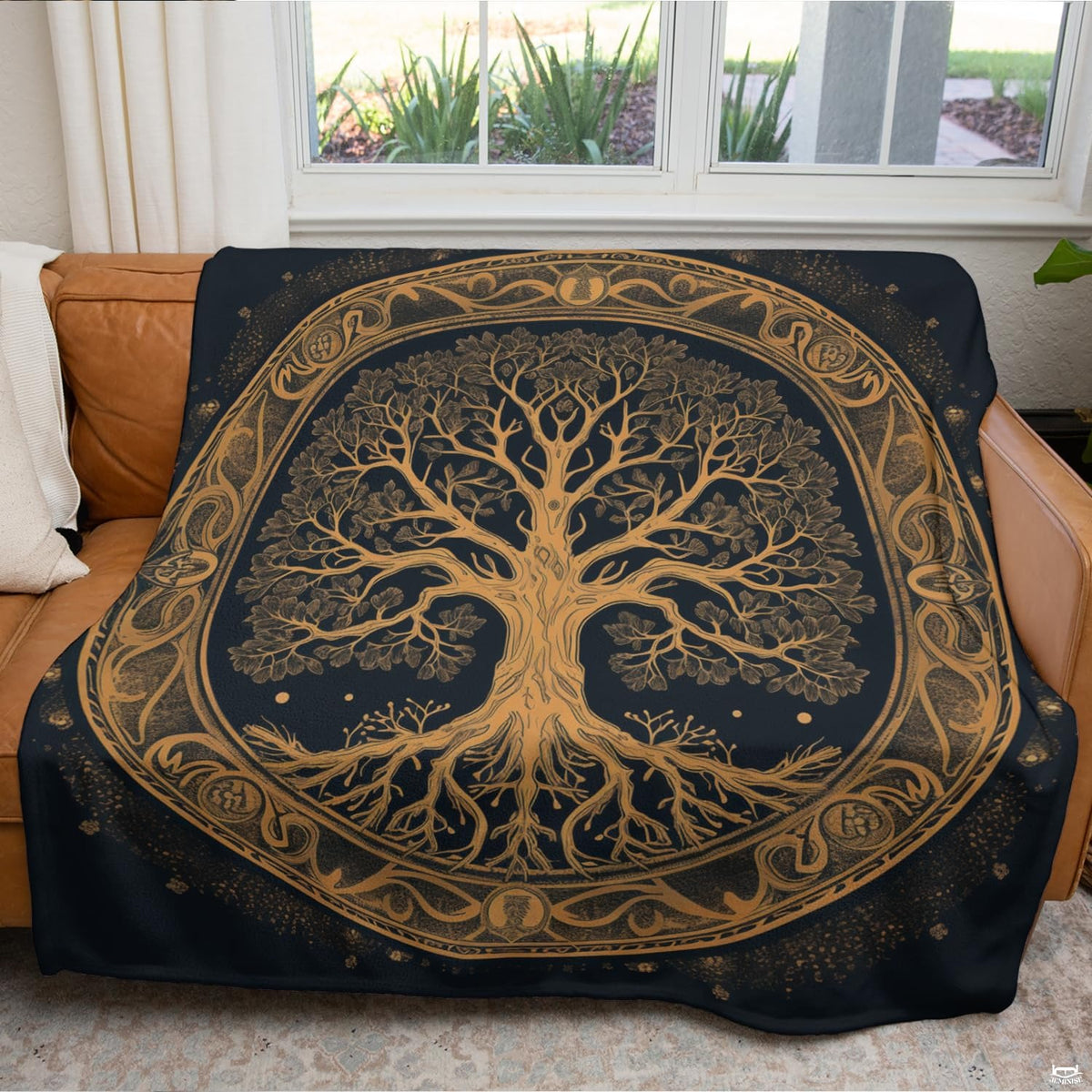 Celtic Tree of Life throw blanket laid neatly over contemporary bed with gold accent cushions