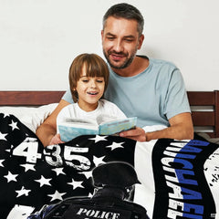 Close view of tactical officer vest and city skyline blue line blanket