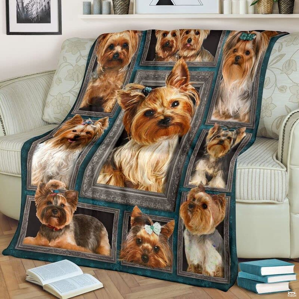 Close view of center Yorkie dog in ornate silver picture frame on blanket