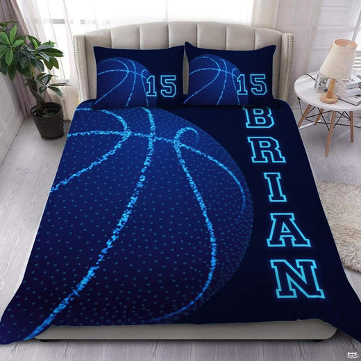 Glowing blue dot basketball bedding featuring stippled basketball artwork and electric contour curves on navy