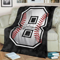 Dark bedding set double featuring grey camo and baseball graphics spread over a bed.