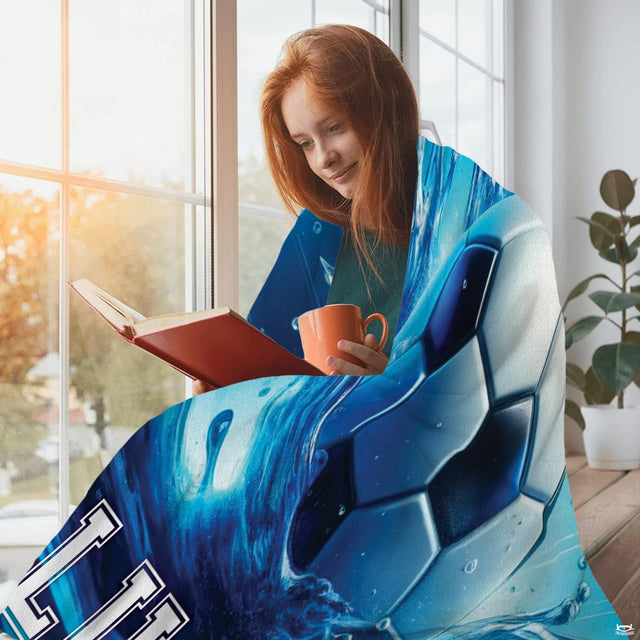 Overhead layout of soccer bedding featuring dynamic water splash droplets and ocean blue background.