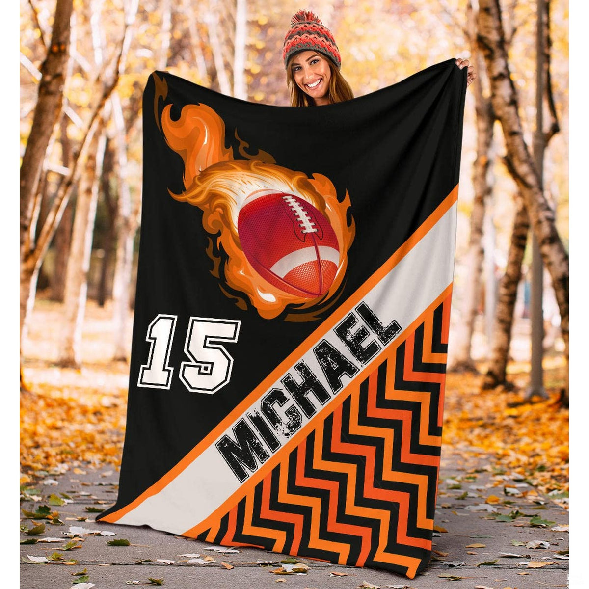 Football comet and chevron pattern blanket displayed on armchair