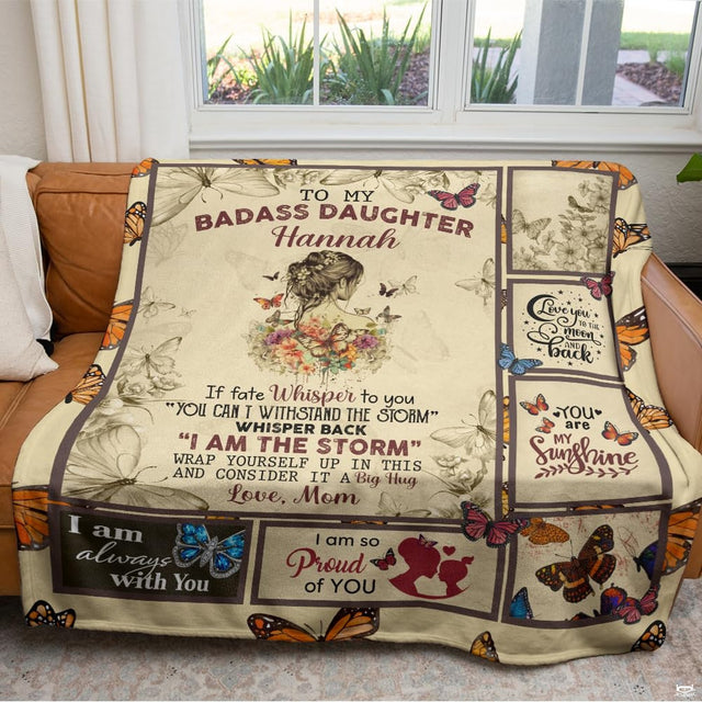 Detail of motivational typography panels and vibrant orange monarch butterfly graphics on a blanket