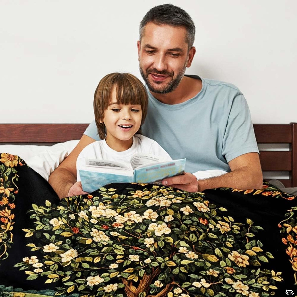 Detailed view of woodland wildflowers and spreading tree roots line artwork on Blanket.