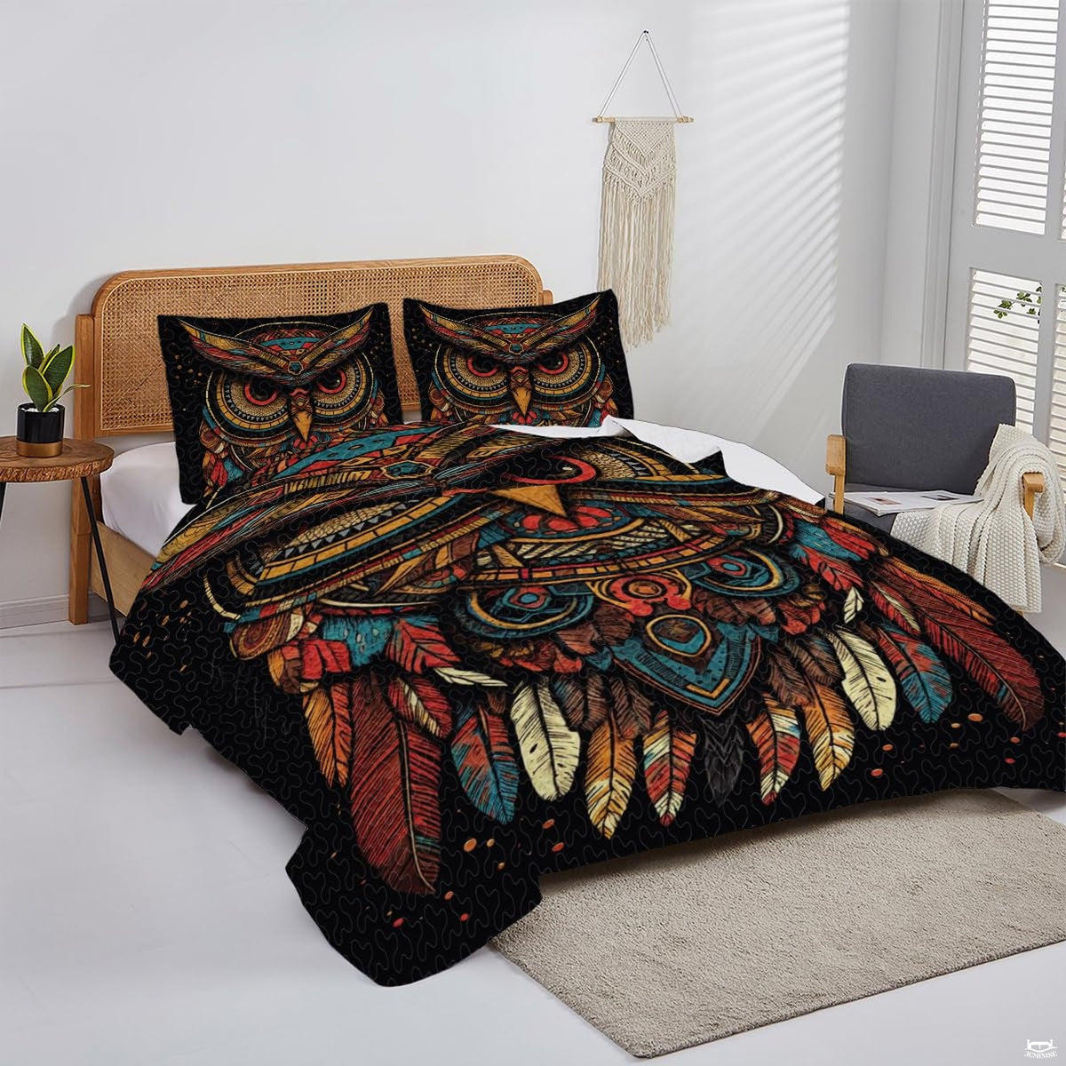 Overhead perspective of owl bedding arranged neatly across a mattress with cabin lodge room decor