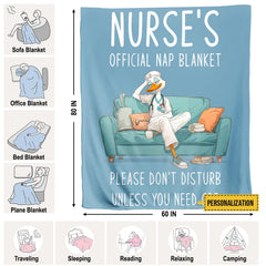 Folded resting nurse duck cartoon throw blanket resting on wooden table displaying teal sofa art