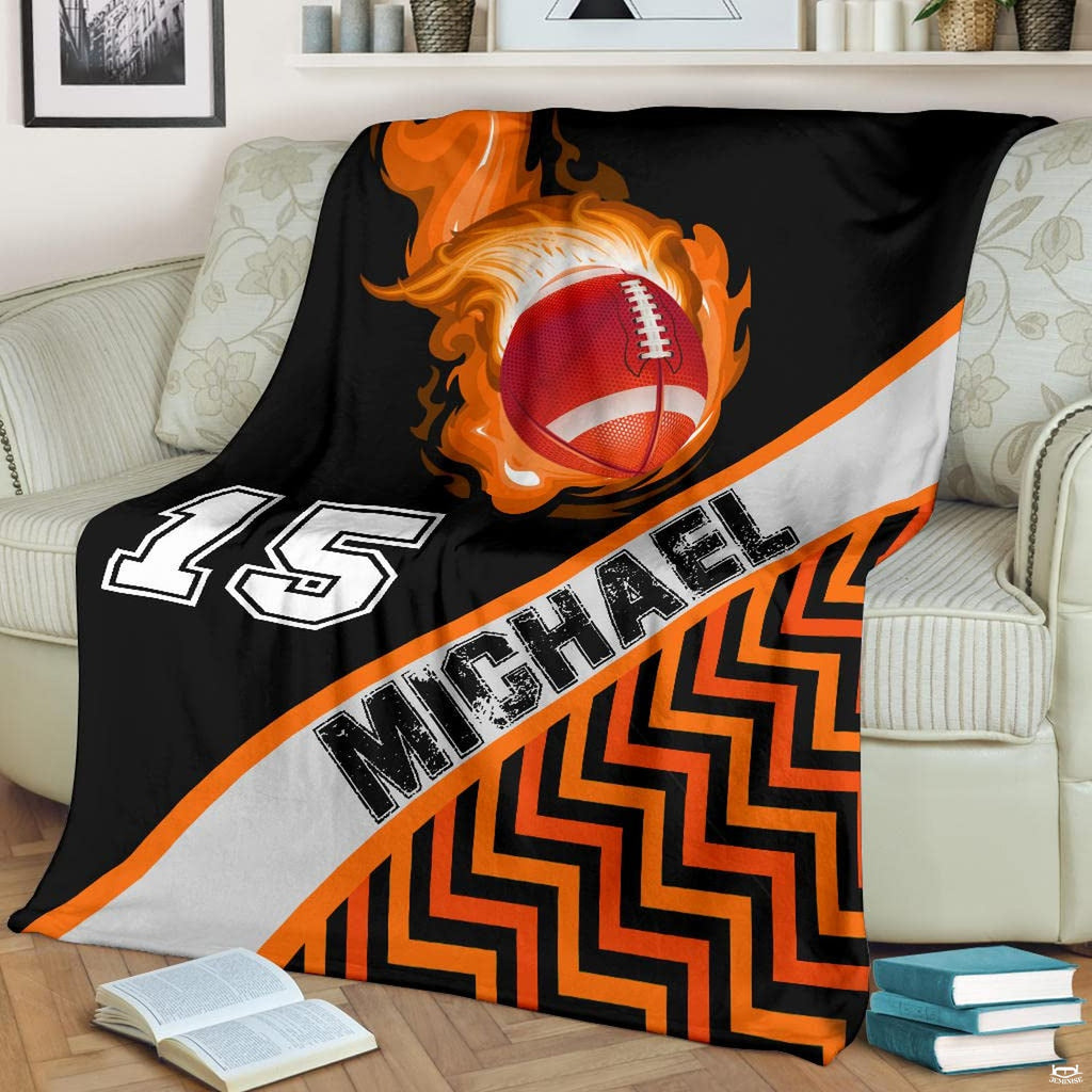 Fiery comet football chevron stripe blanket draped over sofa