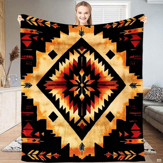 Southwestern geometric Aztec throw blanket featuring stepped diamond starburst and tribal arrows in gold and red