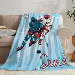 Athletic ice hockey blanket styled across a grey couch in a sports fan living room