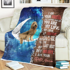 Close view of pup seated on crescent moon and starry nebula on blanket