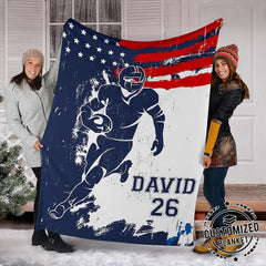 Close view of sprinting football runner silhouette and paint splatters on blanket