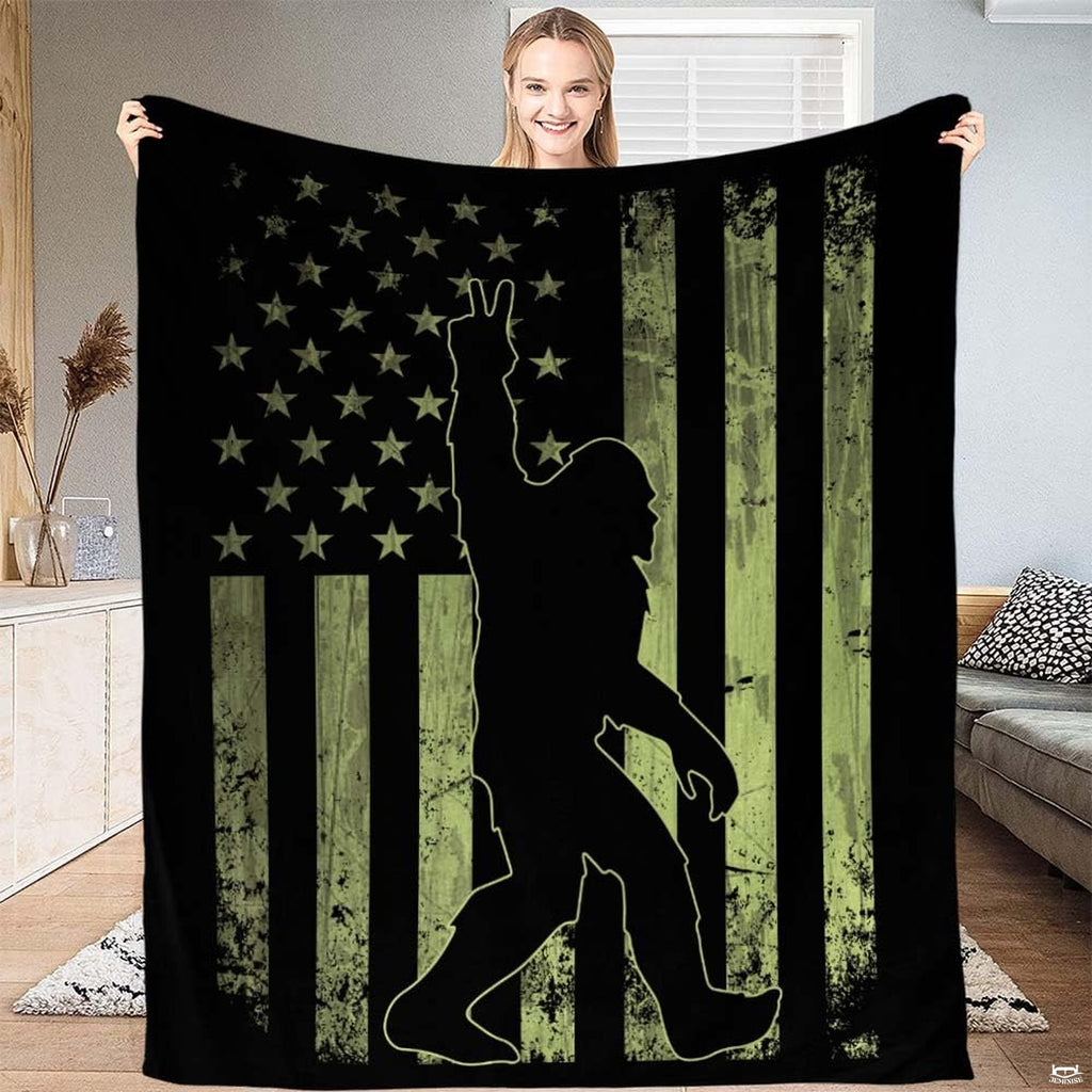 Tactical green Bigfoot American flag throw blanket featuring peace sign Sasquatch on olive drab flag