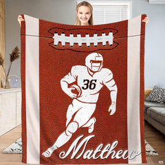 Football runner throw blanket held upright showcasing pebbled grain texture and side stripes.