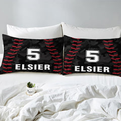 Side angle view of athletic sports bedding showing vivid red and midnight black tones draped on mattress