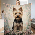 Yorkshire Terrier puppy portrait centered amid blush pink blossoms on floral dog bed cover bedding set.