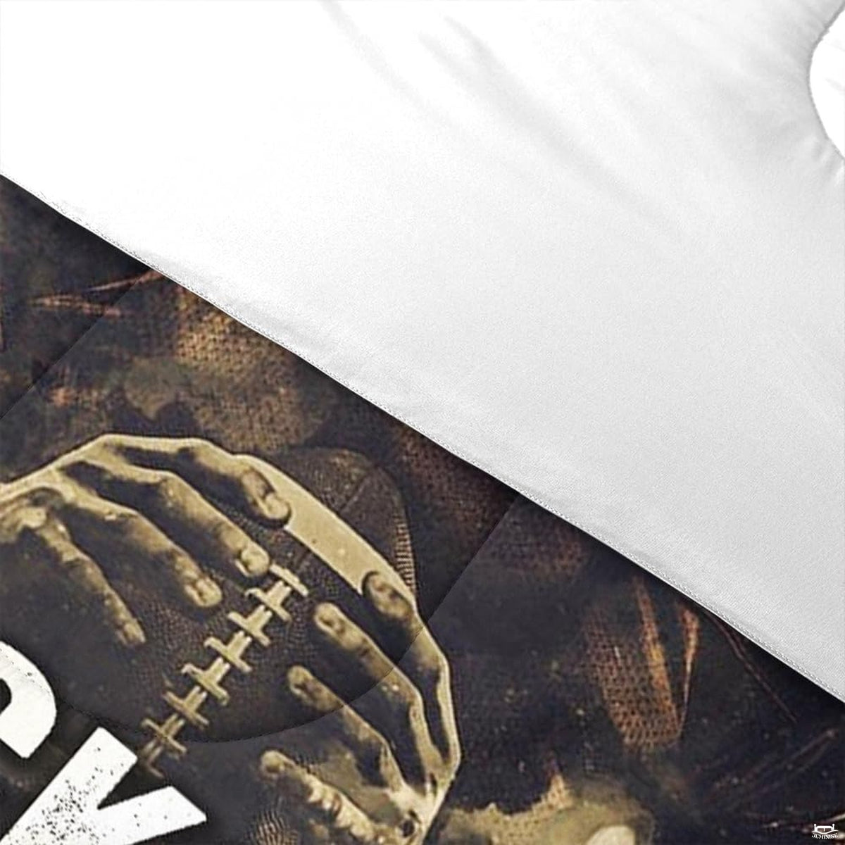 Angle view of athletic bedding illustrating platinum silver and charcoal footballer graphic textures