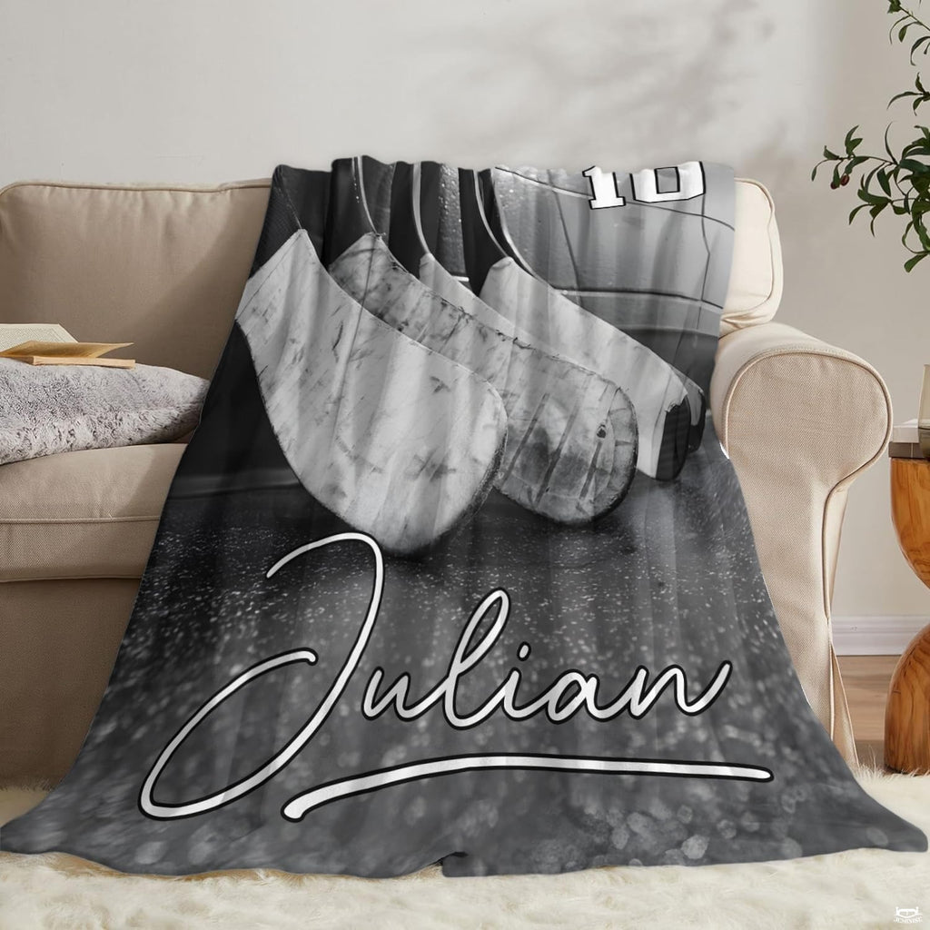 Folded ice hockey sticks throw blanket on wooden bench