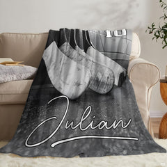 Folded ice hockey sticks throw blanket on wooden bench