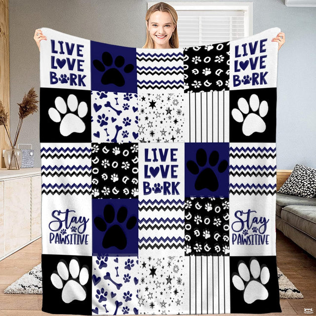 Navy dog paw print patchwork throw blanket with bold puppy paws and chevron zigzag blocks
