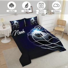 Close-up perspective of midnight soccer bedding showing detailed ball panels and glowing light flare