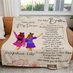 Lifestyle bedroom view showing the colorful sisterhood throw blanket styled across a bed.