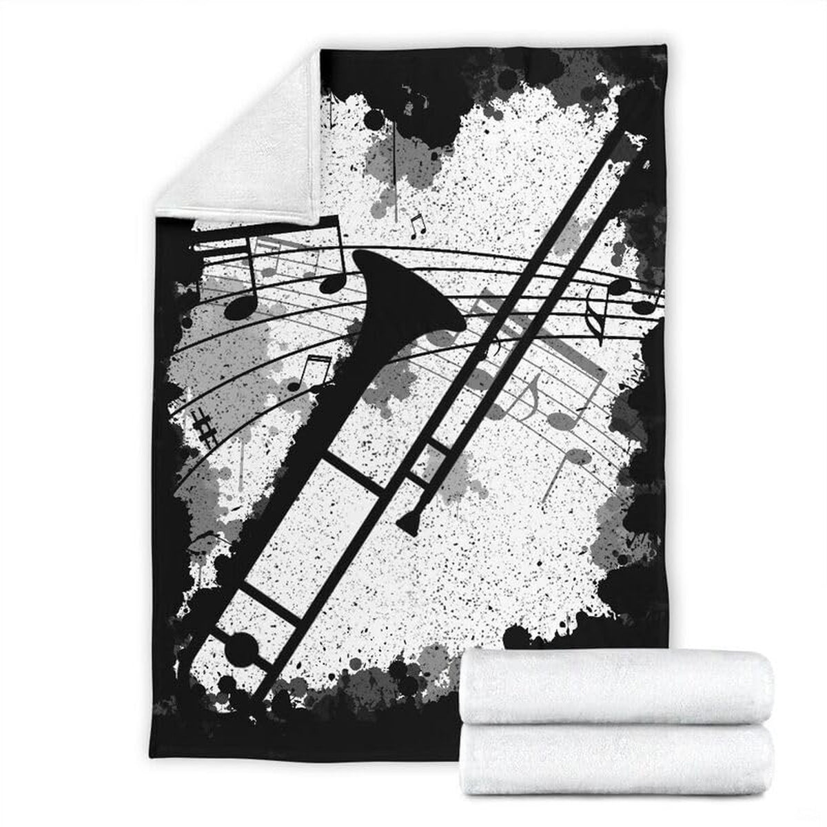 Trombone music graphic blanket spread across a bed in a modern room setting.