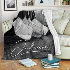 Monochrome ice hockey sticks throw blanket draped across living room sofa