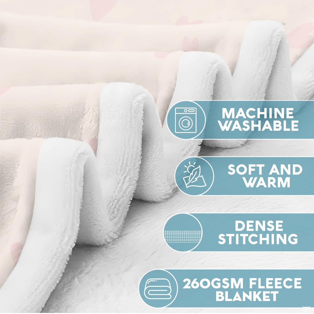 Close-up view of folded family tree blanket displaying plush fabric texture and neat seams