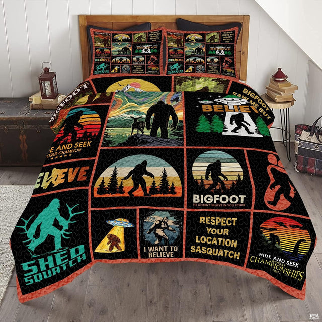 Wilderness bed spread featuring rustic thematic accent patchwork illustrations and forest scenery.
