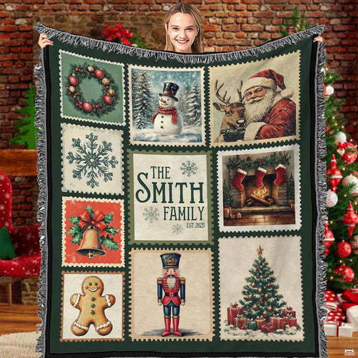 Vintage Christmas postage stamp throw blanket held open by woman