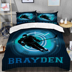 Top-down view of neon cyan flaming hockey bedding set arranged neatly on a youth bedroom mattress