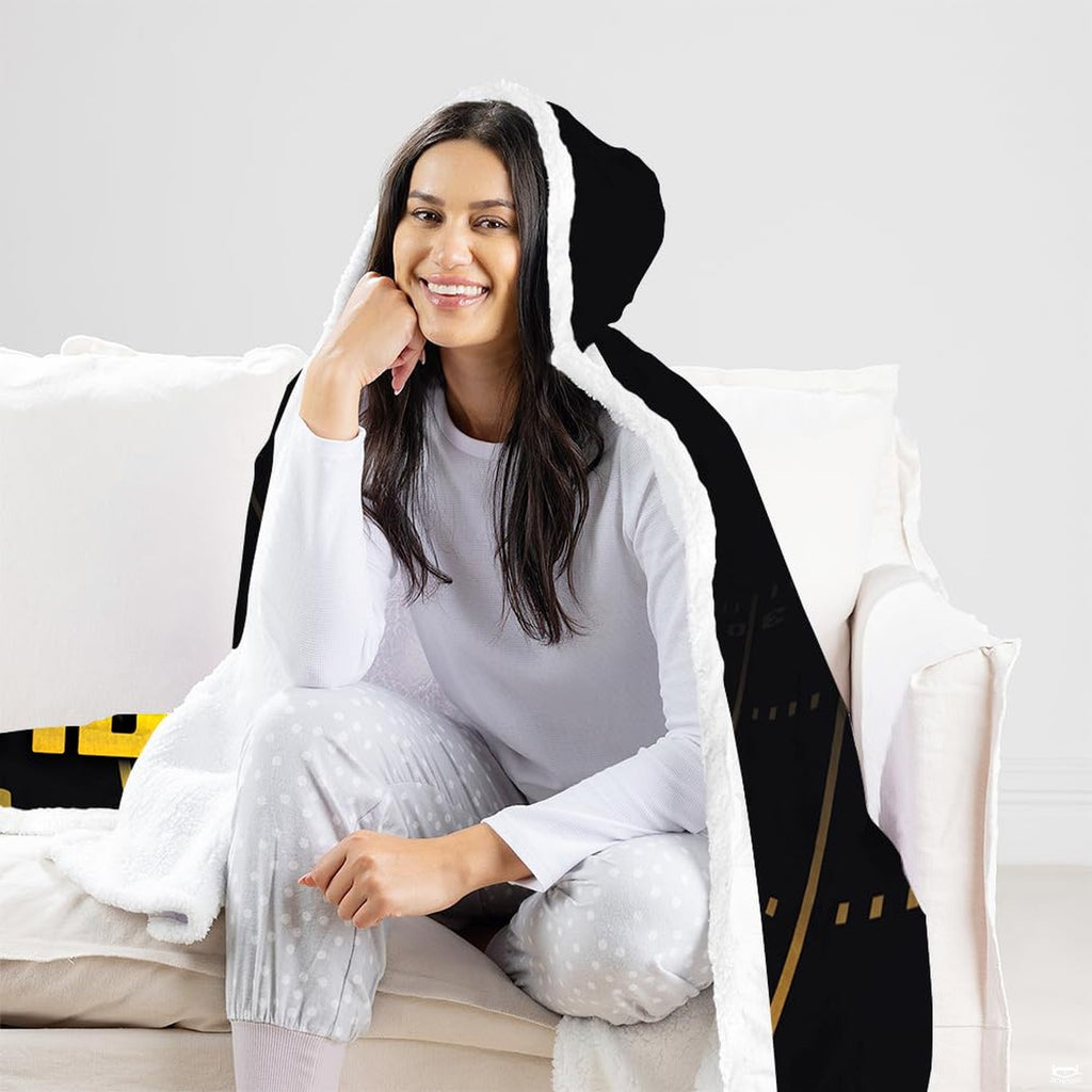 Lifestyle room setting featuring black and gold football throw blanket accenting teen bedroom