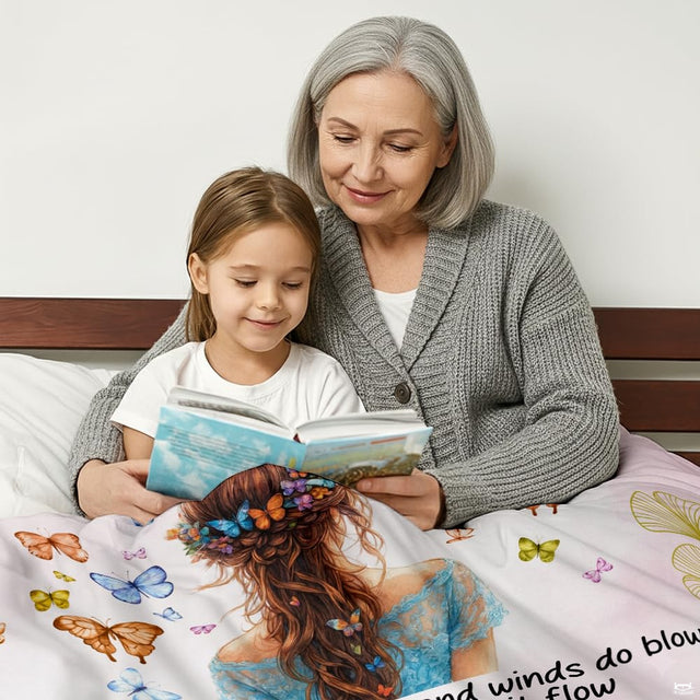 Close-up of braided hairstyle adorned with colorful butterflies and flowers on a daughter blanket