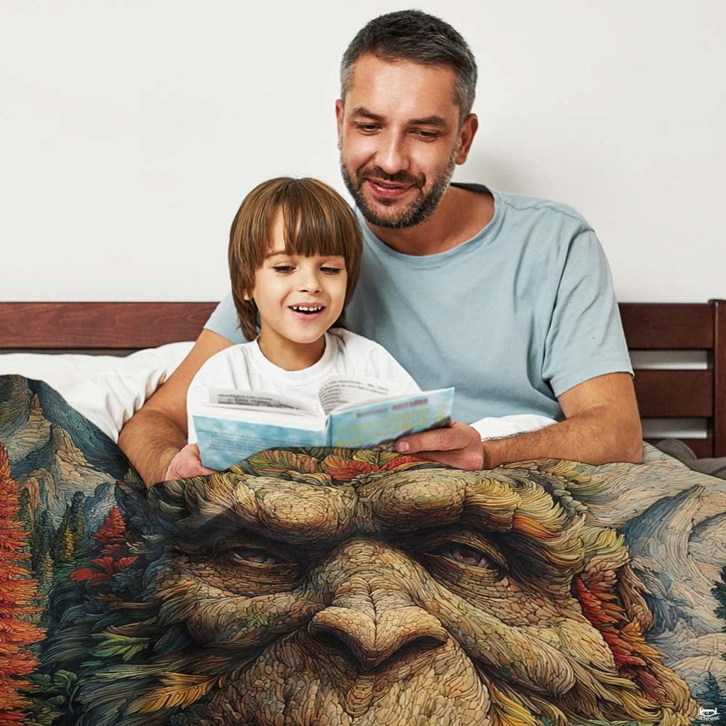 Bigfoot forest spirit throw blanket view 3 highlighting Sasquatch facial artwork and autumn woodland foliage