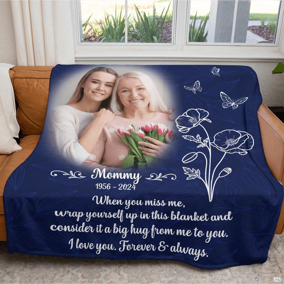 Poppy memorial throw blanket arranged neatly across a bedroom bed