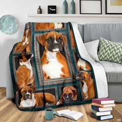 Grey couch arrangement featuring the Fawn Boxer Dog blanket draped beside patterned pillows.